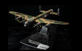 An Avro Lancaster Metal Model Plane Dambuster, Raised on a plinth