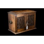 Oak Smoker's Cabinet, with two front opening carved wooden doors,