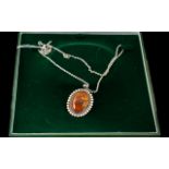 Amber & Silver Pendant, suspended on a fancy silver 24" chain, pendant size with bale 55 ml.