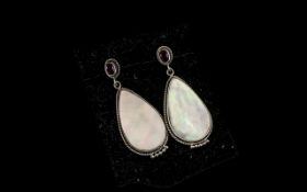 Ruby and Mother of Pearl Drop Earrings, two oval cut rubies, bezel set and fitted with post and