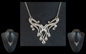 Silver Art Nouveau Pendant Suspended on Silver Chain.