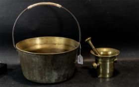 Brass Pestle 7 Mortar Set, together with a brass cauldron with handle, 12" diameter x 14" tall.