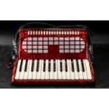 Vintage Piano Accordion by Chanson, red, in fitted carrying bag.