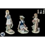 Collection of Three Lladro Figures, comprising Lladro Daisa No.1287, Girl picking wild flowers, 6.