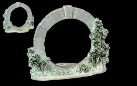 A Lladro Tableau circular garden design. Height 10 1/2 inches, 11 inches wide.