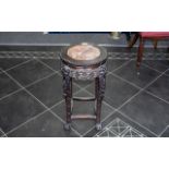 A Chinese Marble Topped Stand, circular shaped top, carved floral frieze. Height 24", diameter 13".
