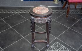 A Chinese Marble Topped Stand, circular shaped top, carved floral frieze. Height 24", diameter 13".