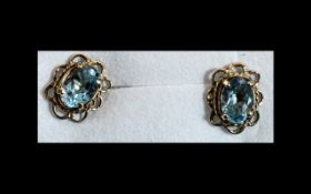 Aquamarine Solitaire Stud Earrings set in 9ct gold scalloped frames with post and push back