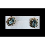 Aquamarine Solitaire Stud Earrings set in 9ct gold scalloped frames with post and push back