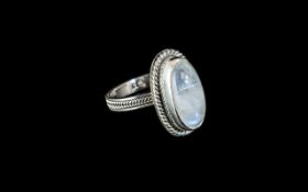 Moonstone Solitaire Ring, size R; 6.5cts of moonstone, with flashes of blue inner light or '