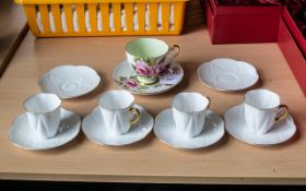 Shelley Bone China Tea Set comprising six saucers and four tea cups in white ground with gilt trim,