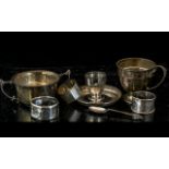 A Small Mixed Lot of Silver, to include three napkin rings, egg cup and saucer, beaker,