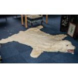 Large Polar Bear Rug, cream with articulated tongue, glass eyes and fitted teeth.