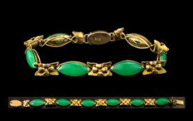 14ct Gold & Jadeite Bracelet, set with six marquise shaped green stones,