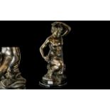 A Modern Reproduction Bronze of a kneeling nude with serpent. Height 19 inches.