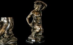 A Modern Reproduction Bronze of a kneeling nude with serpent. Height 19 inches.