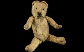 Early 20th Century Straw Filled Jointed Teddy Bear, with Merrythought tag to foot.