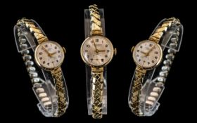 Ladies Excalibar 17 Jewel Manuel Wind Wrist Watch, 9ct Gold Case and Gold Plated Expanding Bracelet.