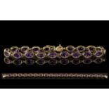 Ladies Attractive and Good Quality 9ct Gold Amethyst Set Line Bracelet. Full Hallmark for 9ct - 9.