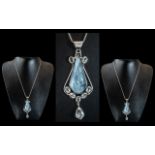 A large Unusual Sterling Silver Pendant Set with A Large Aquamarine along with Seven Oval and one