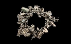 A Superb Vintage Sterling Silver Charm Bracelet - Loaded with ( 30 ) Excellent Charms.