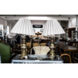 Pair of Brass Art Nouveau Style Table Lamps, decorated bases with cream decorative pleated shades.