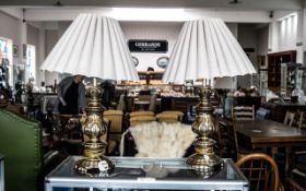 Pair of Brass Art Nouveau Style Table Lamps, decorated bases with cream decorative pleated shades.