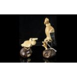 Two Tagua Nut Amazonian Hand Made Figures, depicting an Eagle perched on a branch,