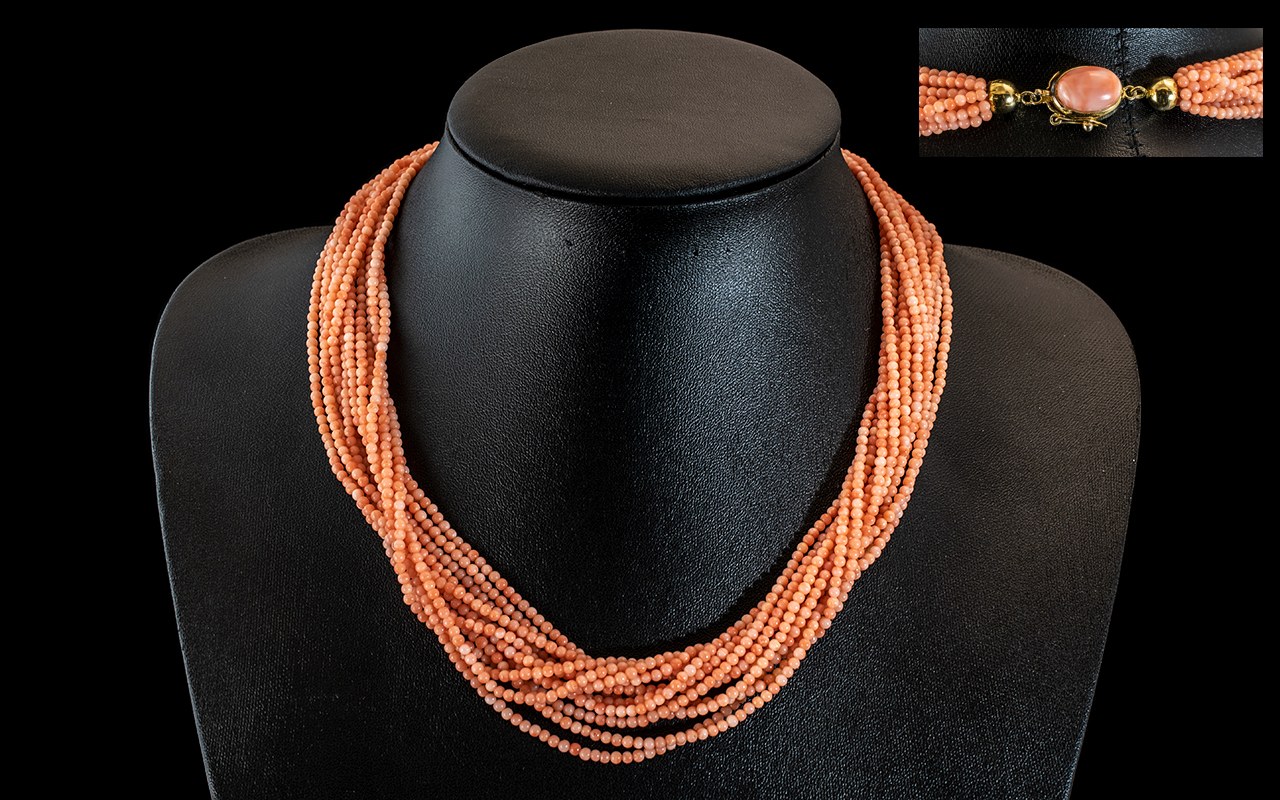 18ct Gold - 12 Strand Coral Necklace of Superb Quality and Wonderful Colour. Marked to Clasp 18ct.