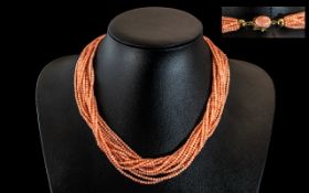 18ct Gold - 12 Strand Coral Necklace of Superb Quality and Wonderful Colour. Marked to Clasp 18ct.