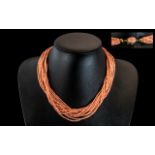 18ct Gold - 12 Strand Coral Necklace of Superb Quality and Wonderful Colour. Marked to Clasp 18ct.