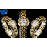 Ladies Rotary Wrist Watch with decorative strap, white face with Roman numerals.