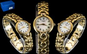 Ladies Rotary Wrist Watch with decorative strap, white face with Roman numerals.