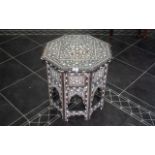 An Eastern Arabesque Inlaid Table, profusely inlaid throughout with bone, octagonal top,