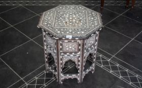 An Eastern Arabesque Inlaid Table, profusely inlaid throughout with bone, octagonal top,