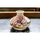 Moorcroft Hibiscus Vase 5" tall, cream base with pink hibiscus pattern.