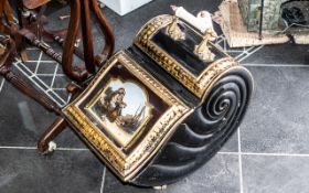 A Victorian Tin Coal Scuttle with painted front depicting children, ceramic handle complete with