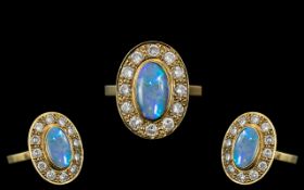 18ct Gold - Stunning Black Opal and Diamond Set Dress Ring. The Oval Shaped Black Opal of Top