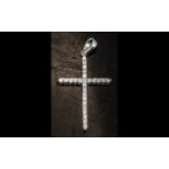 A 14ct White Gold Diamond Set Cross fully hallmarked. Height including bale 1 1/4 inches.