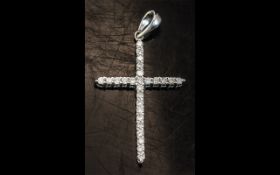 A 14ct White Gold Diamond Set Cross fully hallmarked. Height including bale 1 1/4 inches.