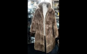 Ladies Musquash Flank Coat, golden colour, collar and reveres, two slit side pockets,