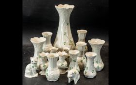 Quantity of Belleek Pottery, comprising assorted vases, of various sizes and designs,