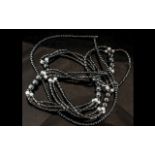 A Single Strand Hematite Necklace, 20" long, with a magnetic clasp,