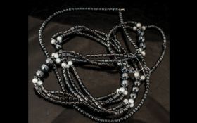 A Single Strand Hematite Necklace, 20" long, with a magnetic clasp,