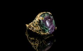 Ruby Zoisite Statement Ring, a 21ct oval cut cabochon of the rarely seen, mysterious,