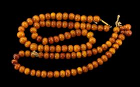 Antique Period - Amber Beaded Necklace with High Ct Gold Clasp. Excellent Colour. 16 Inches - 40.