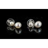 White Cultured Pearl Drop Earrings, each earring having a single,