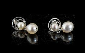 White Cultured Pearl Drop Earrings, each earring having a single,
