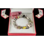 Sterling Silver Charm Bracelet by 'Truth', loaded with modern charms including an owl, bee, piano,