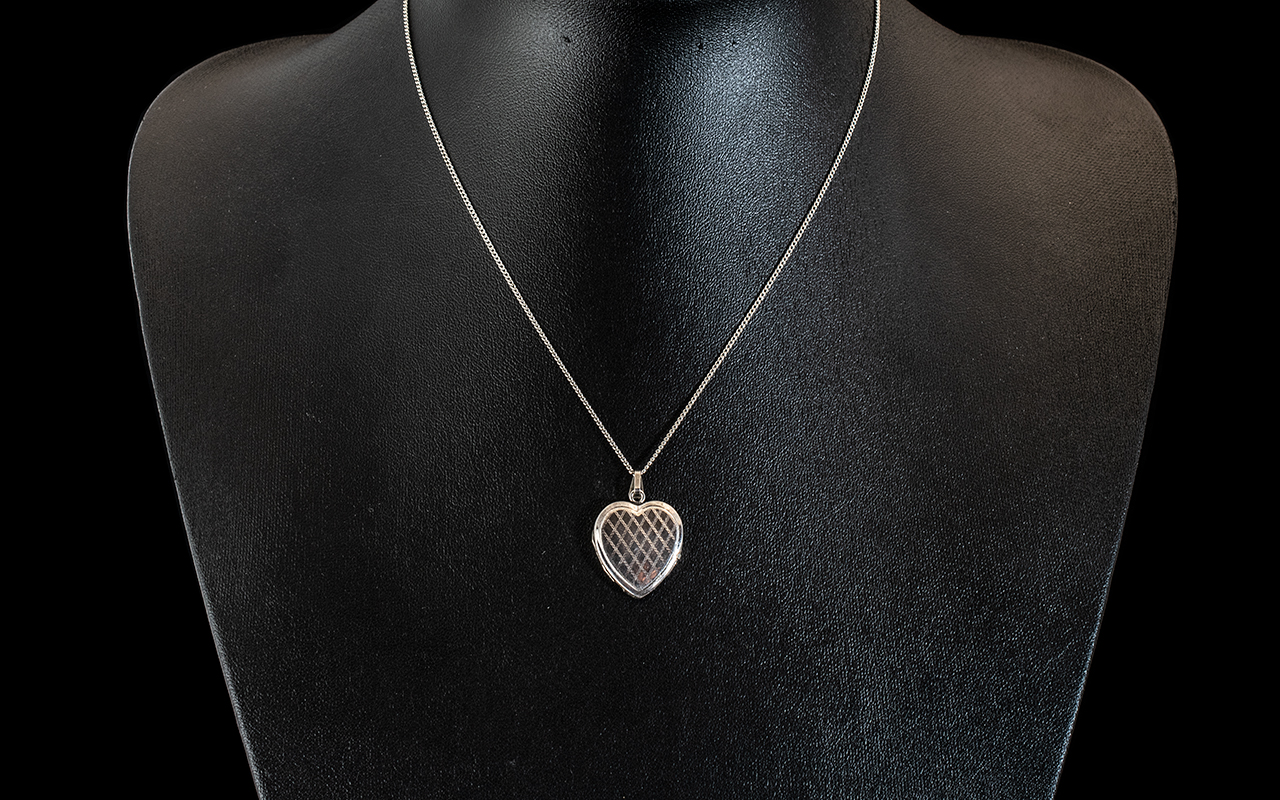 Silver Heart Shaped Locket on a White Metal Chain. Silver Heart Shaped Locket on White Metal